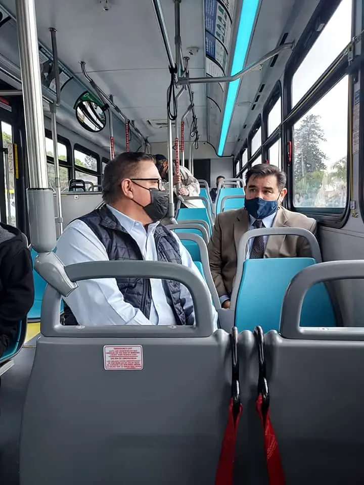 Congressman Carbajal and MTD GM Estrada sit on an MTD bus.